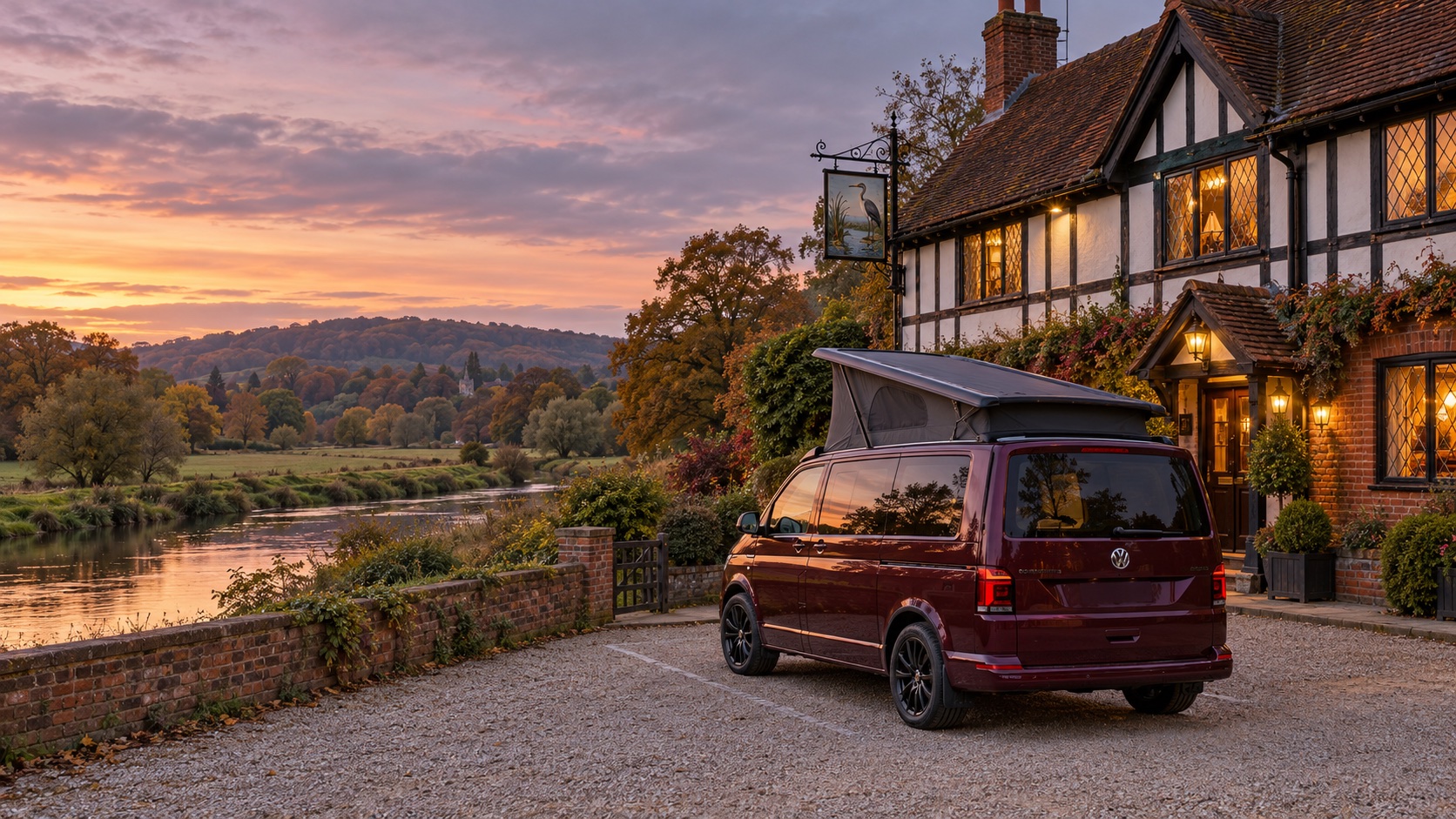 A campervan parked by a riverside pub